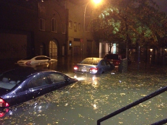 22nd Street, just outside the front door of the Spears Bldg., during Hurricane Sandy. Photographer unknown.
