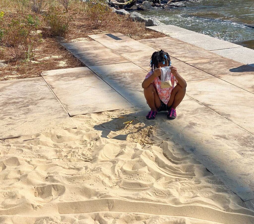 A little girl plays in the sand at Gansevoort Peninsula. Photo: Annik LaFarge, author of On the High Line